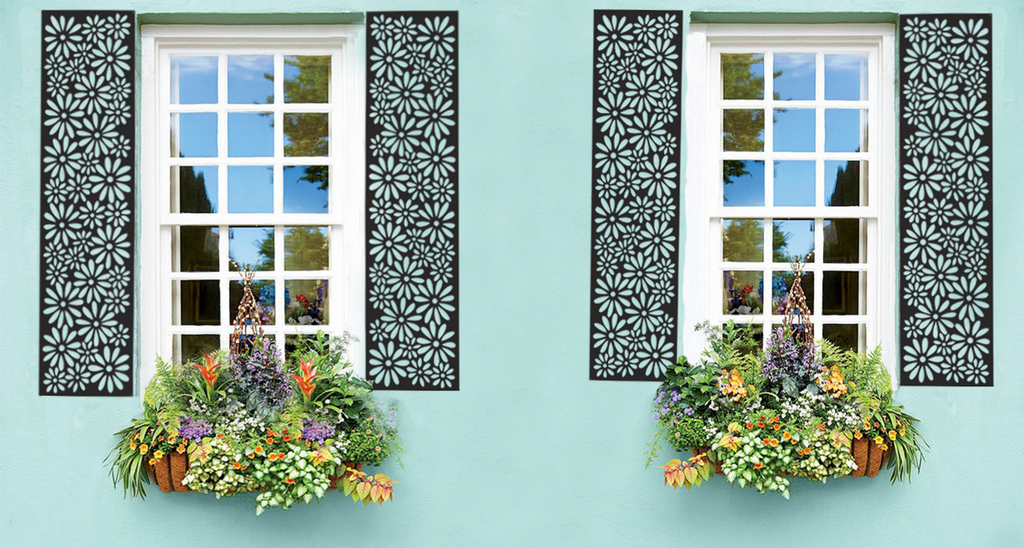 Shutters mounted next to windows on blue building (flowers hanging below)